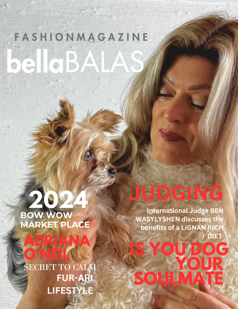 Another "bellaBALAS" fashion magazine cover for 2024, featuring a woman with blonde hair holding a small dog. Text includes "bow wow MARKET PLACE," "ADRIANA O'NEILL SECRET TO CALM FUR-ARI LIFESTYLE," and "JUDGING" with International Judge Ben Wasylshen discussing the benefits of a lignan-rich diet. The question "IS YOUR DOG YOUR SOULMATE" is in red, with a QR code present.